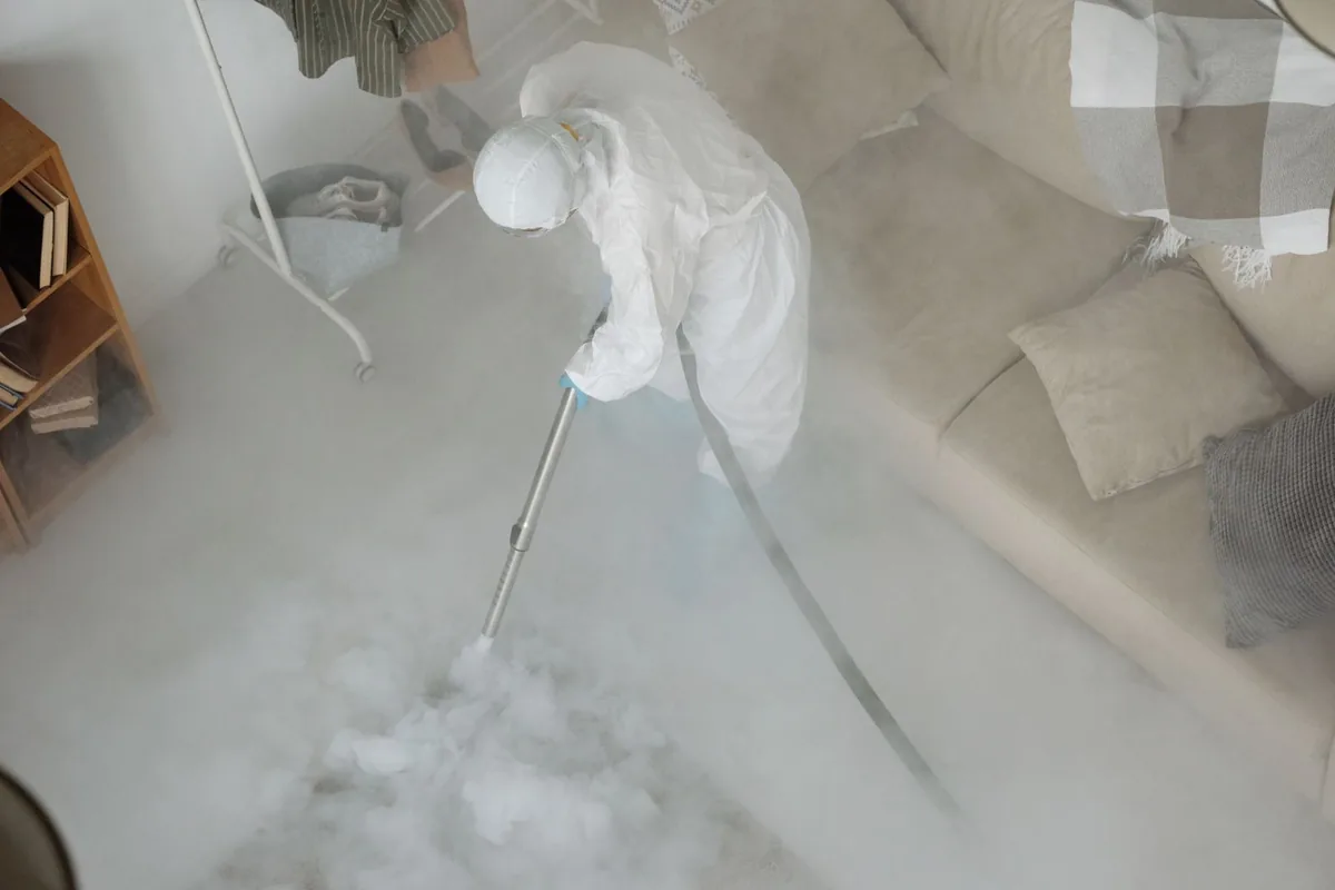Biohazard cleanup technician in protective equipment, Flomaton, AL